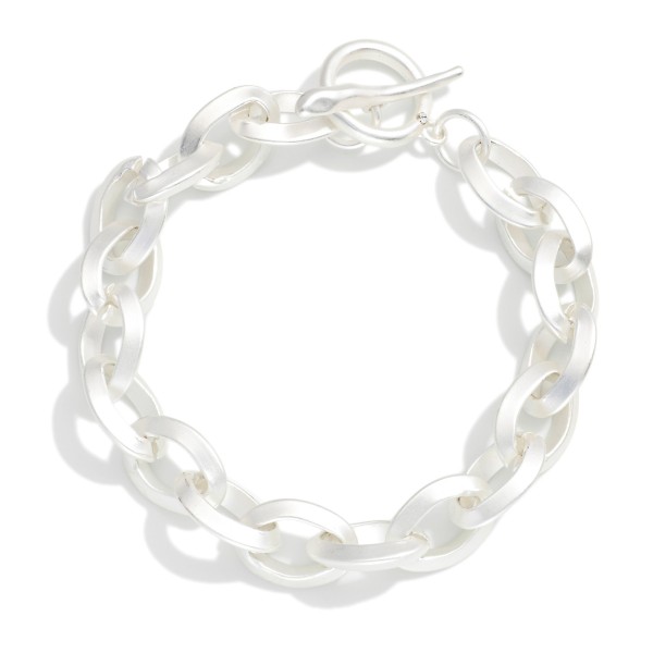 Matte Metal Chain Link Bracelet With Toggle Clasp 

- Approximately 3" D 