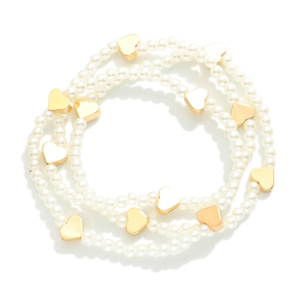 Set Of Three Beaded Stretch Bracelets Featuring Metal Tone Heart Stations 

- Approximately 2.5" D