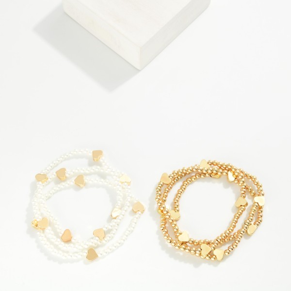 Set Of Three Beaded Stretch Bracelets Featuring Metal Tone Heart Stations 

- Approximately 2.5" D