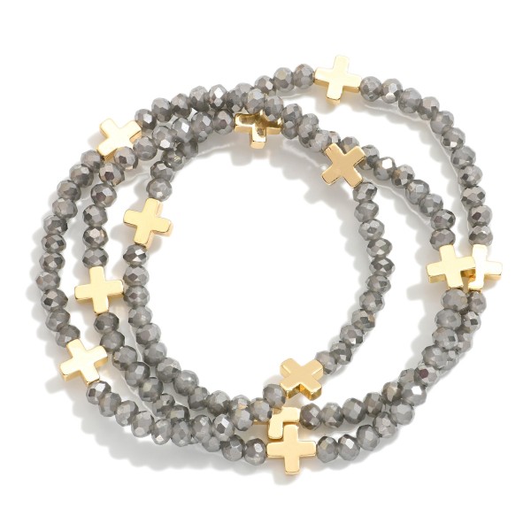 Set Of Three Faceted Bead Stretch Bracelets Featuring Metal Tone Plus Cross Stations 

- Approximately 2.5" D