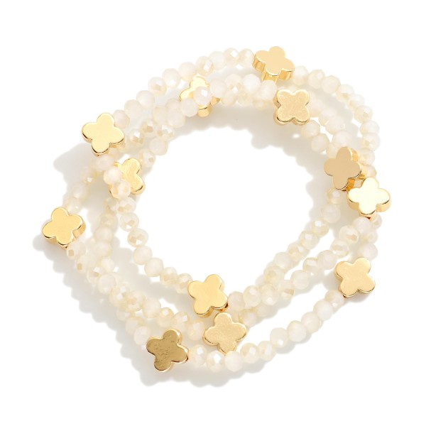 Set Of Three Faceted Bead Stretch Bracelets With Metal Tone Bubble Cross Stations 

- Approximately 2.5" D