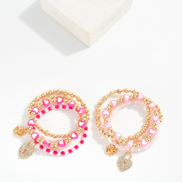 Set Of Four Beaded Stretch Bracelets Featuring Metal Tones , Faceted Beades, & Hearts 

- Approximately 3.5" D 