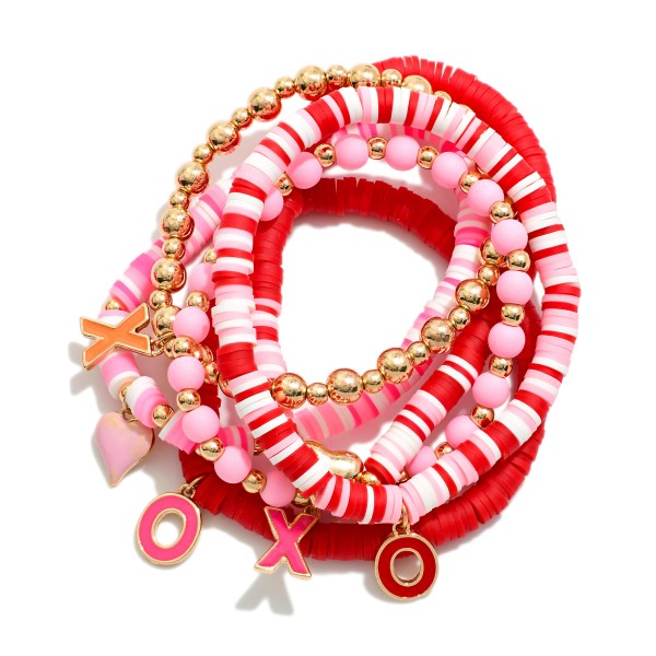 Set Of Six Metal Tone & Heishi Bead Valentines Bracelets With XO Charms 

- Approximately 3.5" D 