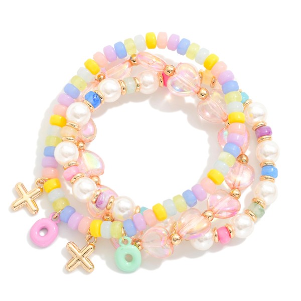 Set Of Three Beaded Stretch Bracelets Featuring Metal Tones,Faceted Beads & "XOXO" Charms 

- Approximately 4" D 