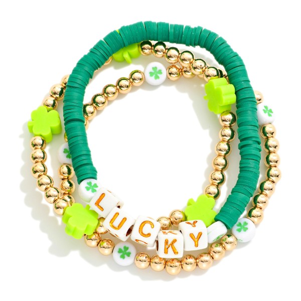 Set Of Three Metal Tone St. Patricks Day Stretch Bracelet Featuring Heishi Bead, "LUCKY" Beads and Gold Tones 

- Approximately 3.5" D 