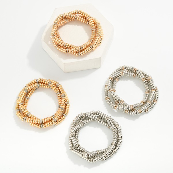 Set Of Three Metal Tone Disk Bead Stretch Bracelets Featuring Rhinestone Details 

- Approximately 2.5" D 

