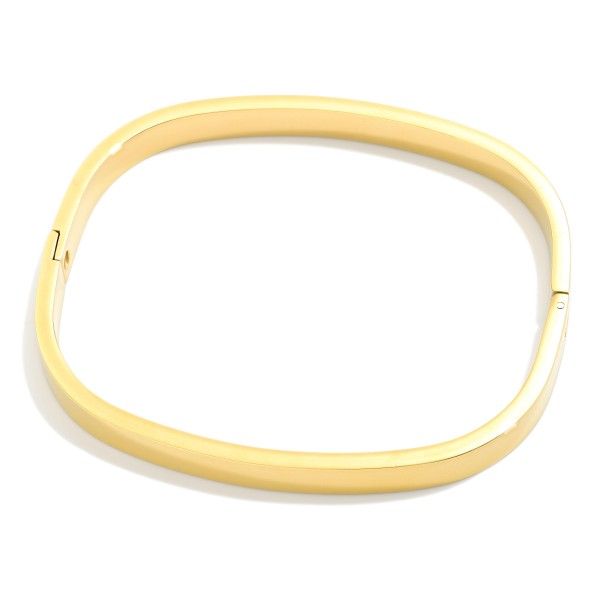Metal Tone Rounded Rectangular Hinged Bangle Bracelet 

- Stainless Steel
- Water Resistant
- Approximately 2" D