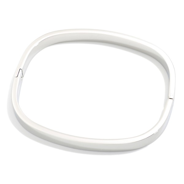 Metal Tone Rounded Rectangular Hinged Bangle Bracelet 

- Stainless Steel
- Water Resistant
- Approximately 2" D