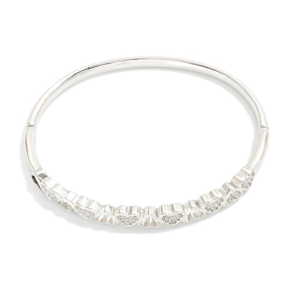 Metal Tone Hinged Bangle Bracelet Featuring Heart & Rhinestone Details 

- Stainless Steel
- Water Resistant
- Approximately 2.5" D