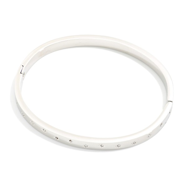 Metal Tone Hinged Bangle Bracelet Featuring Engraved Star & Rhinestone Details 

- Stainless Steel
- Water Resistant
- Approximately .5" D