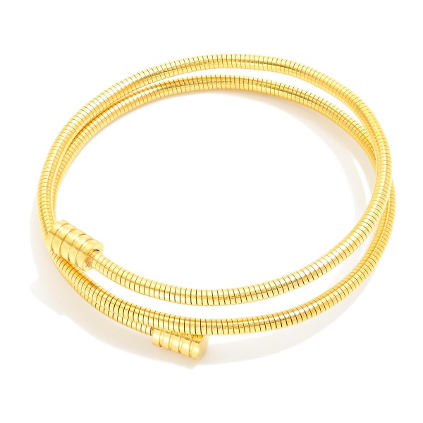Metal Tone Wrap Coil Bracelet 

- Stainless Steel
- Water Resistant
- Approximately 2.5" D