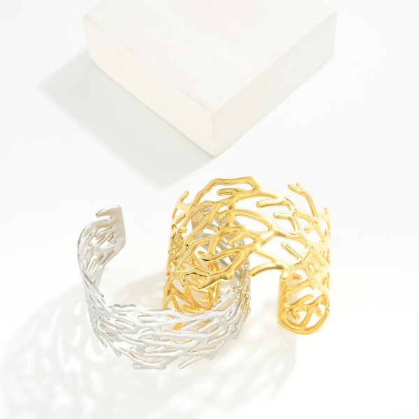 Metal Tone Coral Cuff Bracelet 

- Stainless Steel
- Water Resistant
- Approximately 2.5" D
