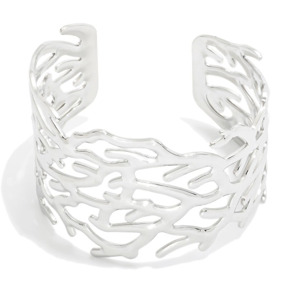 Metal Tone Coral Cuff Bracelet 

- Stainless Steel
- Water Resistant
- Approximately 2.5" D
