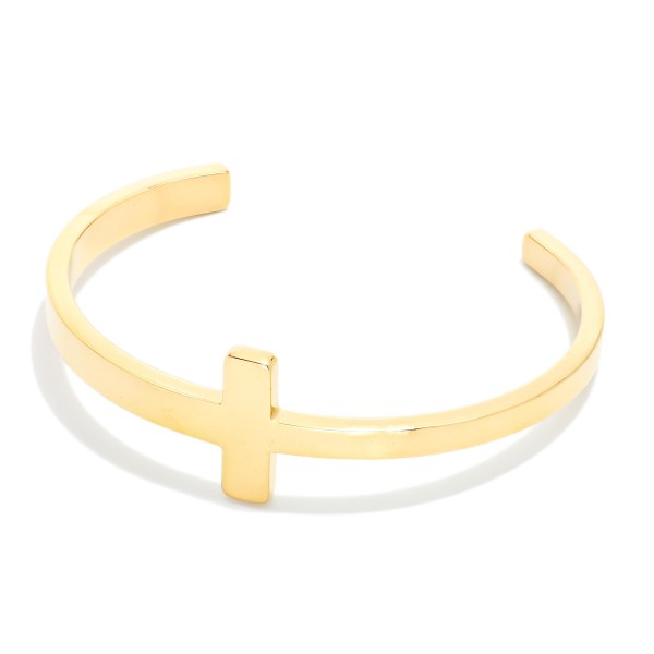 Metal Tone Cross Cuff Bracelet 

- Approximately 2.5" D 
- Stainless Steel
- Water Resistant
