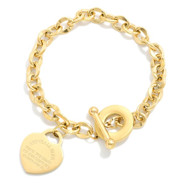 Chain Link Bracelet Featuring Engraved Metal Tone Heart & Toggle Clasp 

- Stainless Steel
- Water Resistant
- Approximately 2.5" D
