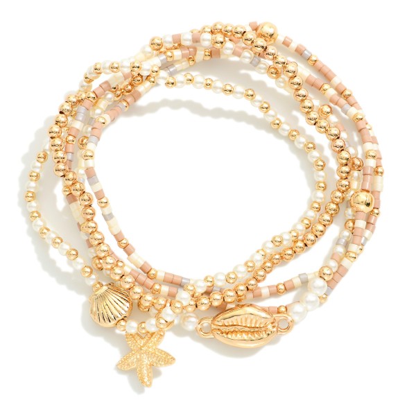 Set Of Five Beaded Stretch Bracelets Featuring Pearls, Seed Beads, & Metal Tone Sea Animal Charms 

- Approximately 2.5" D