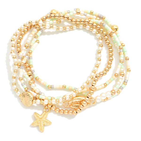 Set Of Five Beaded Stretch Bracelets Featuring Pearls, Seed Beads, & Metal Tone Sea Animal Charms 

- Approximately 2.5" D