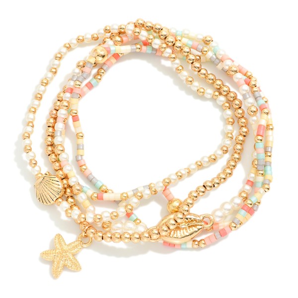 Set Of Five Beaded Stretch Bracelets Featuring Pearls, Seed Beads, & Metal Tone Sea Animal Charms 

- Approximately 2.5" D