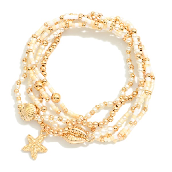 Set Of Five Beaded Stretch Bracelets Featuring Pearls, Seed Beads, & Metal Tone Sea Animal Charms 

- Approximately 2.5" D