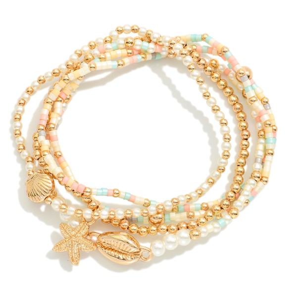 Set Of Five Beaded Stretch Bracelets Featuring Pearls, Seed Beads, & Metal Tone Sea Animal Charms 

- Approximately 2.5" D
