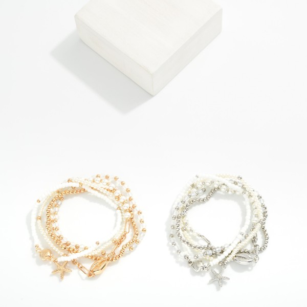 Set Of Five Beaded Stretch Bracelets Featuring Pearls, Metal Tones, & Metal Tone Sea Animal Charms 

- Approximately 2.5" D