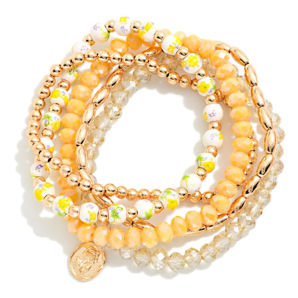 Set Of Five Beaded Stretch Bracelet Featuring Gold Tones, Faceted Beads, And Chinoiserie Flower Beads  

- Approximately 2.5" L
