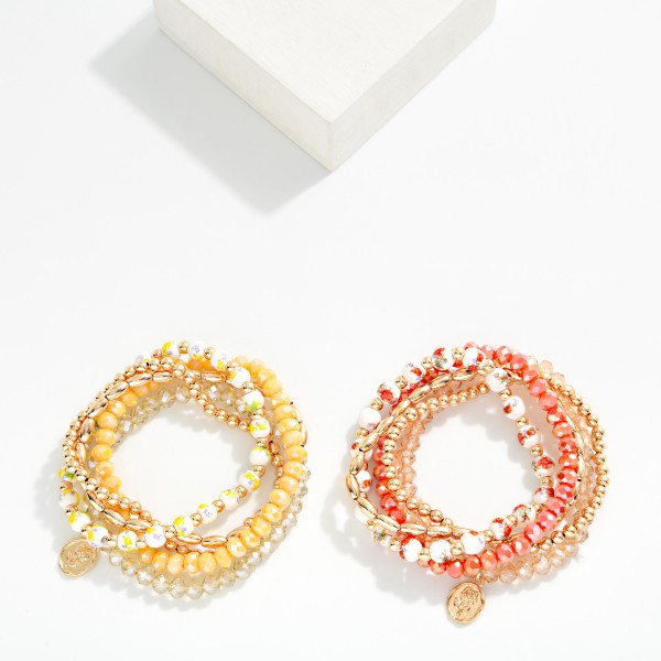 Set Of Five Beaded Stretch Bracelet Featuring Gold Tones, Faceted Beads, And Chinoiserie Flower Beads  

- Approximately 2.5" L
