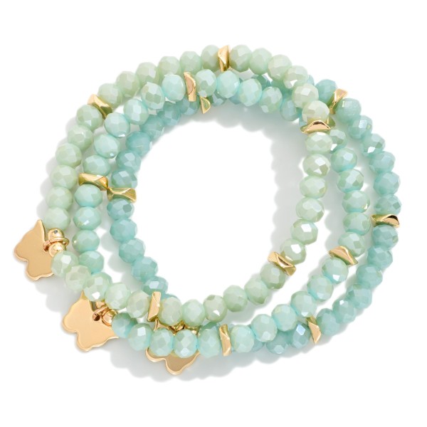 Set Of Three Faceted Class Bead Stretch Bracelet Featuring Gold Tones And Butterfly Charm 

- Approximately 2.5" D  