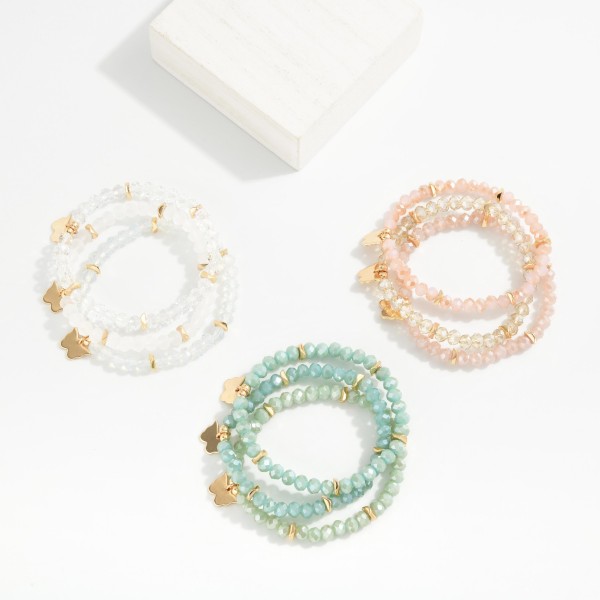 Set Of Three Faceted Class Bead Stretch Bracelet Featuring Gold Tones And Butterfly Charm 

- Approximately 2.5" D  