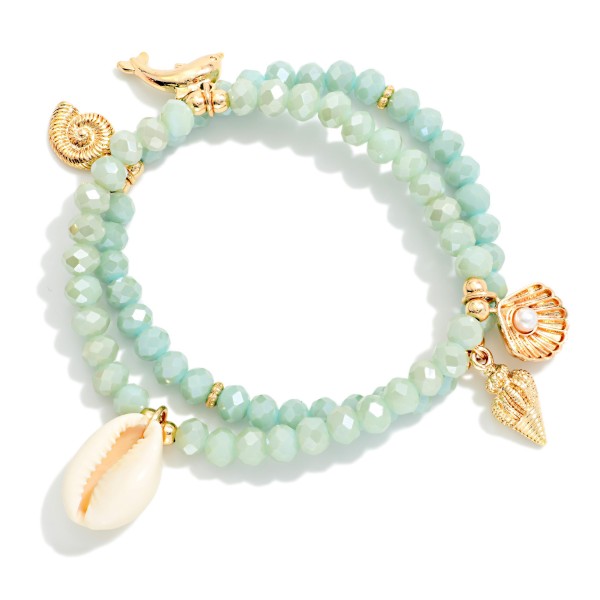 Set Of Two Beaded Stretch Bracelets Featuring Metal Tones & Beach Charms 

- Approximately 2.5" D