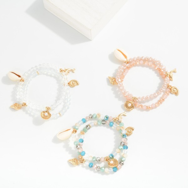 Set Of Two Beaded Stretch Bracelet Featuring Metal Tones & Beach Charms 

- Approximately 2.5" D