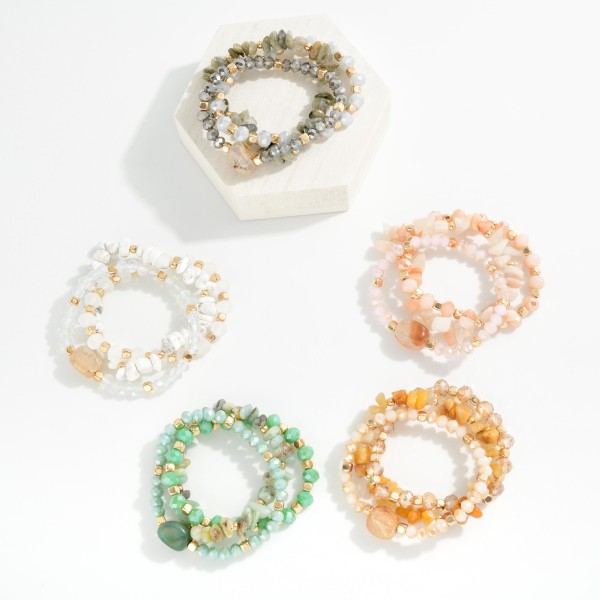 Set Of Three Faceted Beaded Stretch Bracelets Featuring Gold Tones & Stones 

- Approximately 3" D  