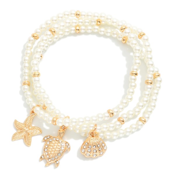 Set Of Three Pearl Bead Stretch Bracelets Featuring Metal Tones, & Beach Charms 

- Approximately  2.5" D 
