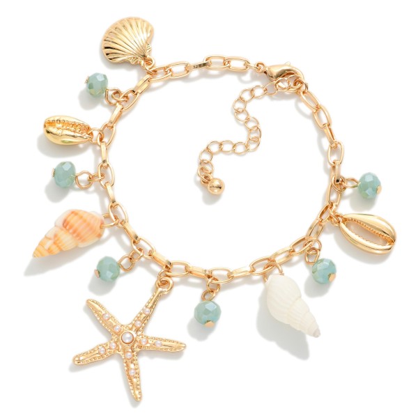 Chain Link Charm Bracelet Featuring Gold tones, Faceted Beads, & Beach Charms 

- Approximately 3" D
- Extender 2" L 
