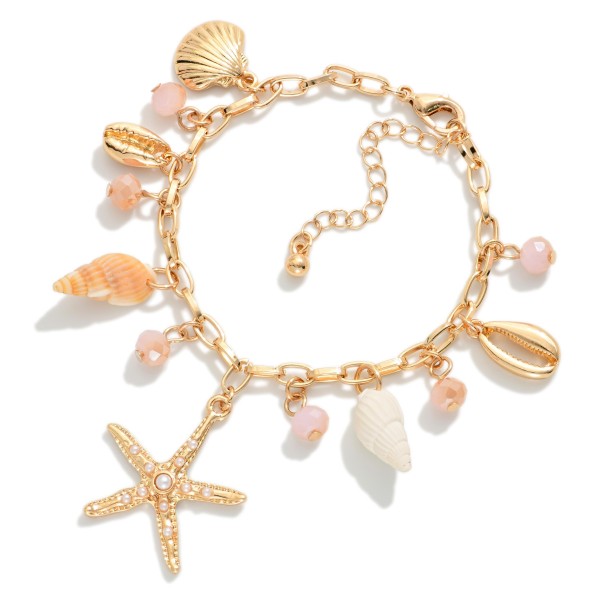 Chain Link Charm Bracelet Featuring Gold tones, Faceted Beads, & Beach Charms 

- Approximately 3" D
- Extender 2" L 
