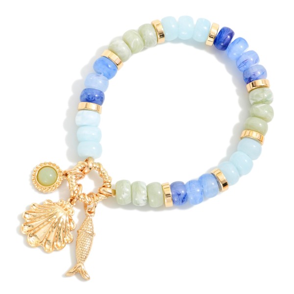 Candy Stone Beaded Stretch Bracelet Featuring Metal Tone Beach Charms 

- Approximately 4" D
 