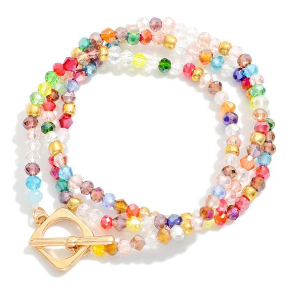 Set Of Three Faceted Bead Stretch Bracelets Featuring Gold Tones & Metal Toggle Clasp 

- Approximately 2.5" D 