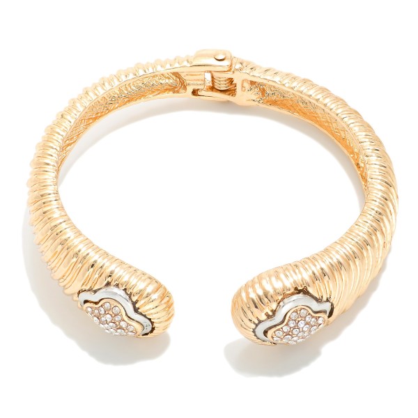 Ribbed Metal Tone Hinged Bangle Bracelet With Clover Detail

- Approximately 2.5" D