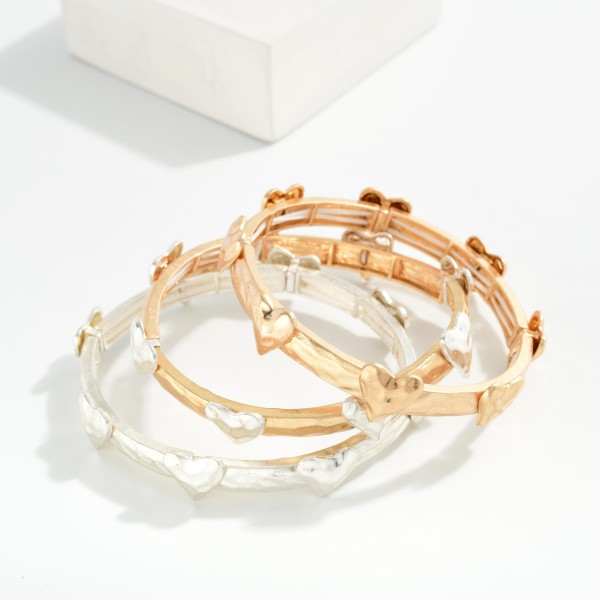 Hammered Metal Stretch Bracelet Featuring Metal Heart Details

- Approximately 2.5" D