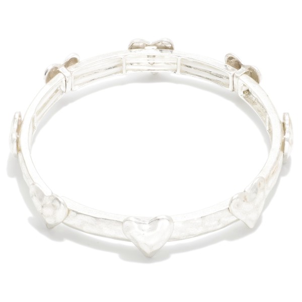 Hammered Metal Stretch Bracelet Featuring Metal Heart Details

- Approximately 2.5" D