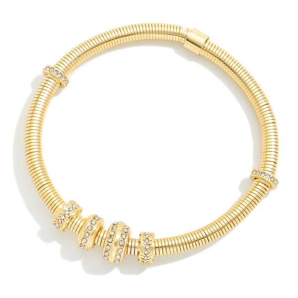 Metal Tone Coil Stretch Bracelet Featuring Rhinestone Bead Detail 

- Approximately 2.5" D