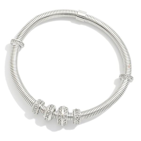 Metal Tone Coil Stretch Bracelet Featuring Rhinestone Bead Detail 

- Approximately 2.5" D