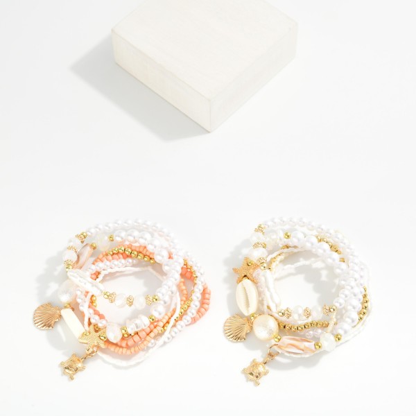 Set Of Seven Beaded Stretch Bracelets Featuring Metal Tones, Pearls, & Shells 

- Approximately 2.5" D