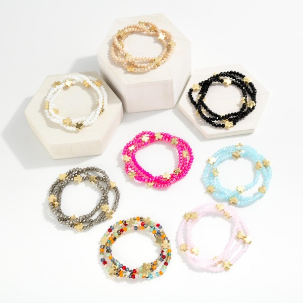 Set Of Three Faceted Bead Stretch Bracelets Featuring Metal Tone Cross Stations 

- Approximately 2.5" D