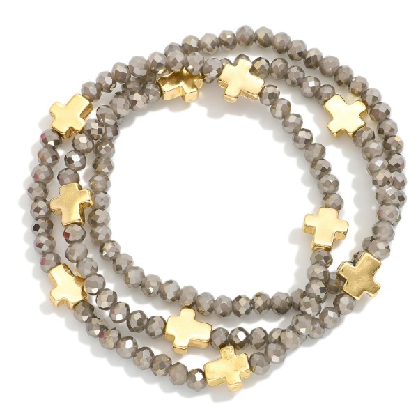 Set Of Three Faceted Bead Stretch Bracelets Featuring Metal Tone Cross Stations 

- Approximately 2.5" D