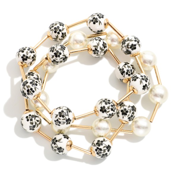 Set Of Three Beaded Stretch Bracelets Featuring Pearls, Metal Tone Tube, & Floral Porcelain Beads

- Approximately 3" D
