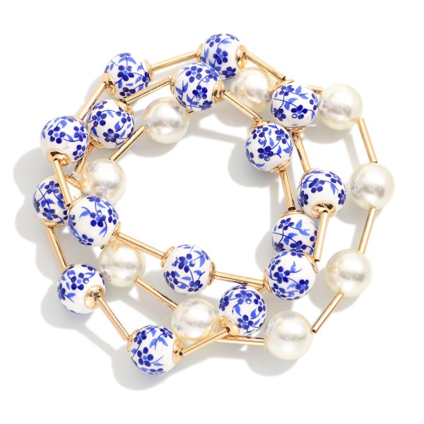 Set Of Three Beaded Stretch Bracelets Featuring Pearls, Metal Tone Tube, & Floral Porcelain Beads

- Approximately 3" D