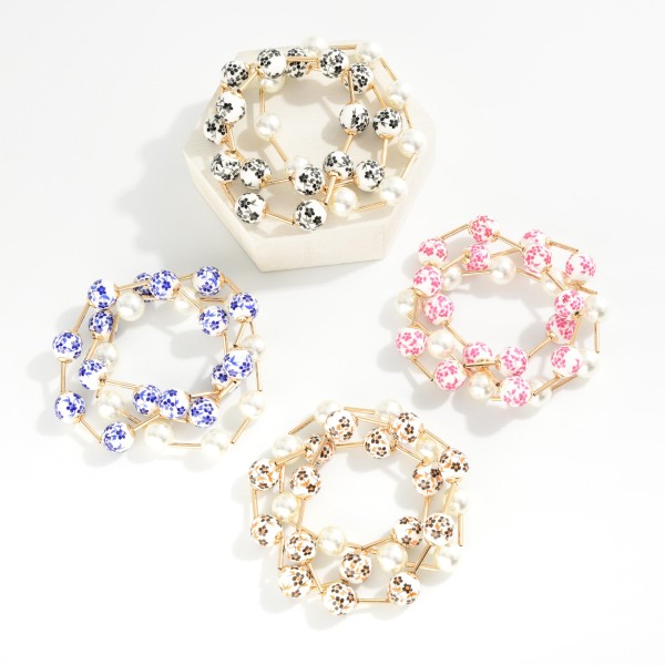Set Of Three Beaded Stretch Bracelets Featuring Pearls, Metal Tone Tube, & Floral Porcelain Beads

- Approximately 3" D