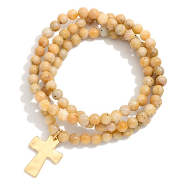 Set Of Three Beaded Stretch Bracelets Featuring Hammered Metal Cross Charm

- Approximately 2.5" D