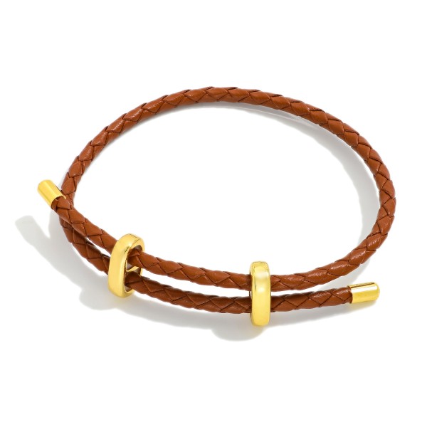Woven Leather Adjustable Bracelet With Gold Tone Accents 

- Approximately 2.5" D